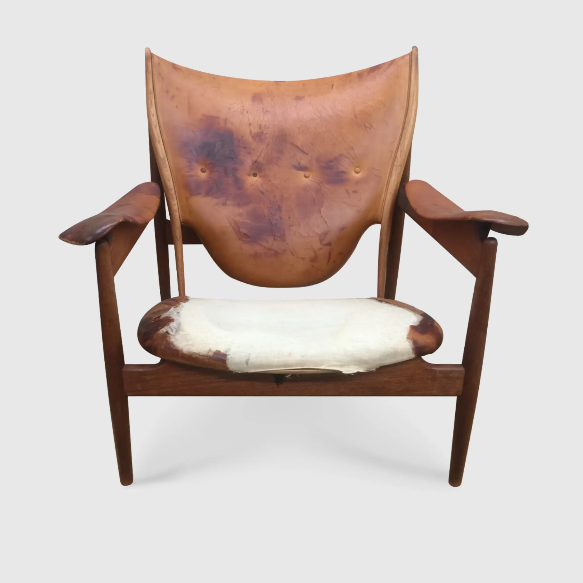 Finn Juhl brown leather chieftan chair torn and stained front view